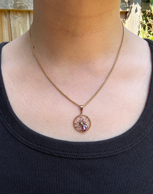 Antique 9ct yellow gold 0.6ct garnet and pearl spider pendant