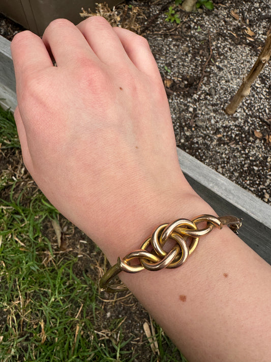 Vintage 9ct rosy yellow gold knot bangle