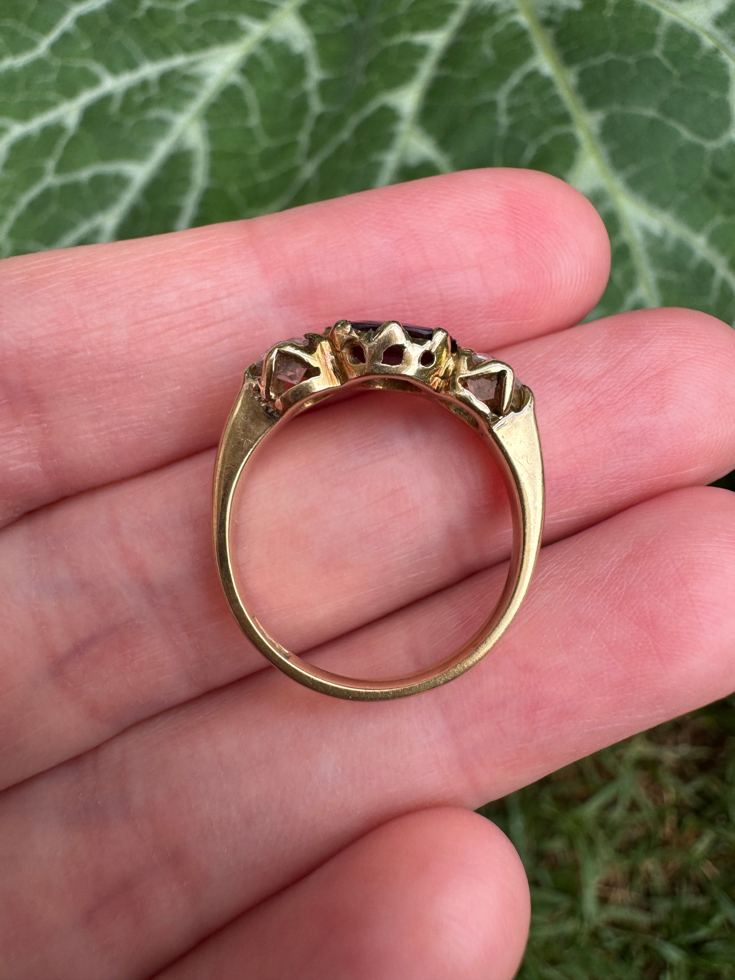 Antique 18ct yellow gold three stone 0.95ct flat cut garnet and 0.45ct TCW old European cut diamond ring
