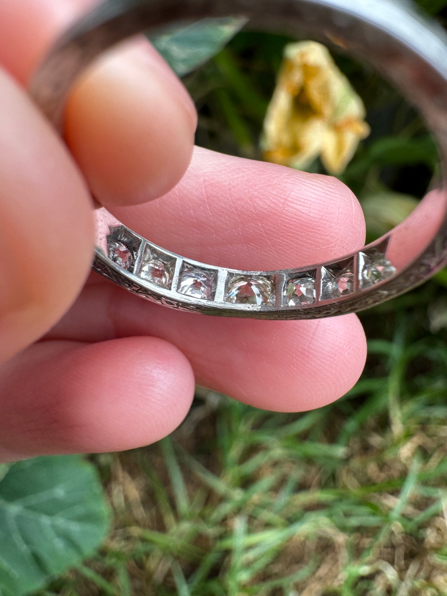 Vintage platinum 0.7ct TCW old mine cut diamond engraved half eternity ring