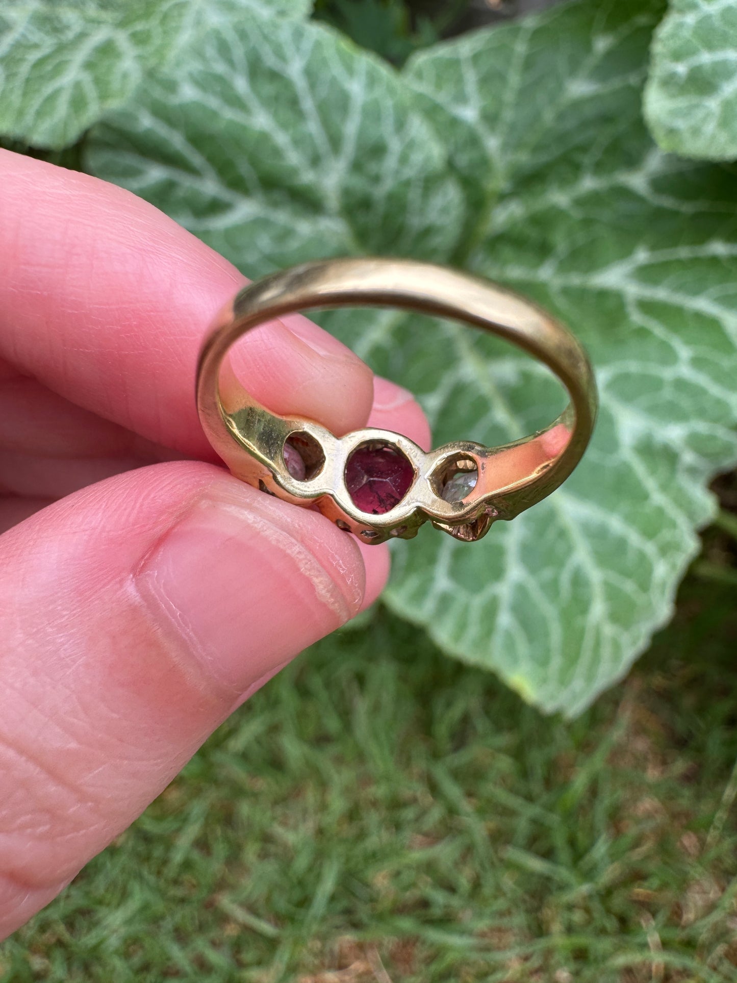 Antique 18ct yellow gold three stone 0.95ct flat cut garnet and 0.45ct TCW old European cut diamond ring