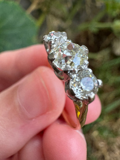 Antique 18ct yellow gold three stone 1.56ct TCW old mine cut diamond ring