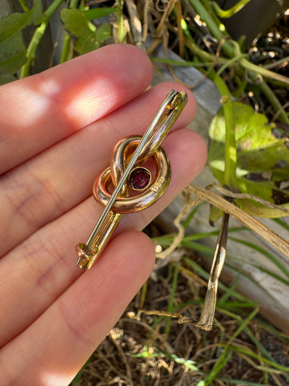 Antique 9ct rosy yellow gold 0.52ct garnet love knot brooch/chain extender