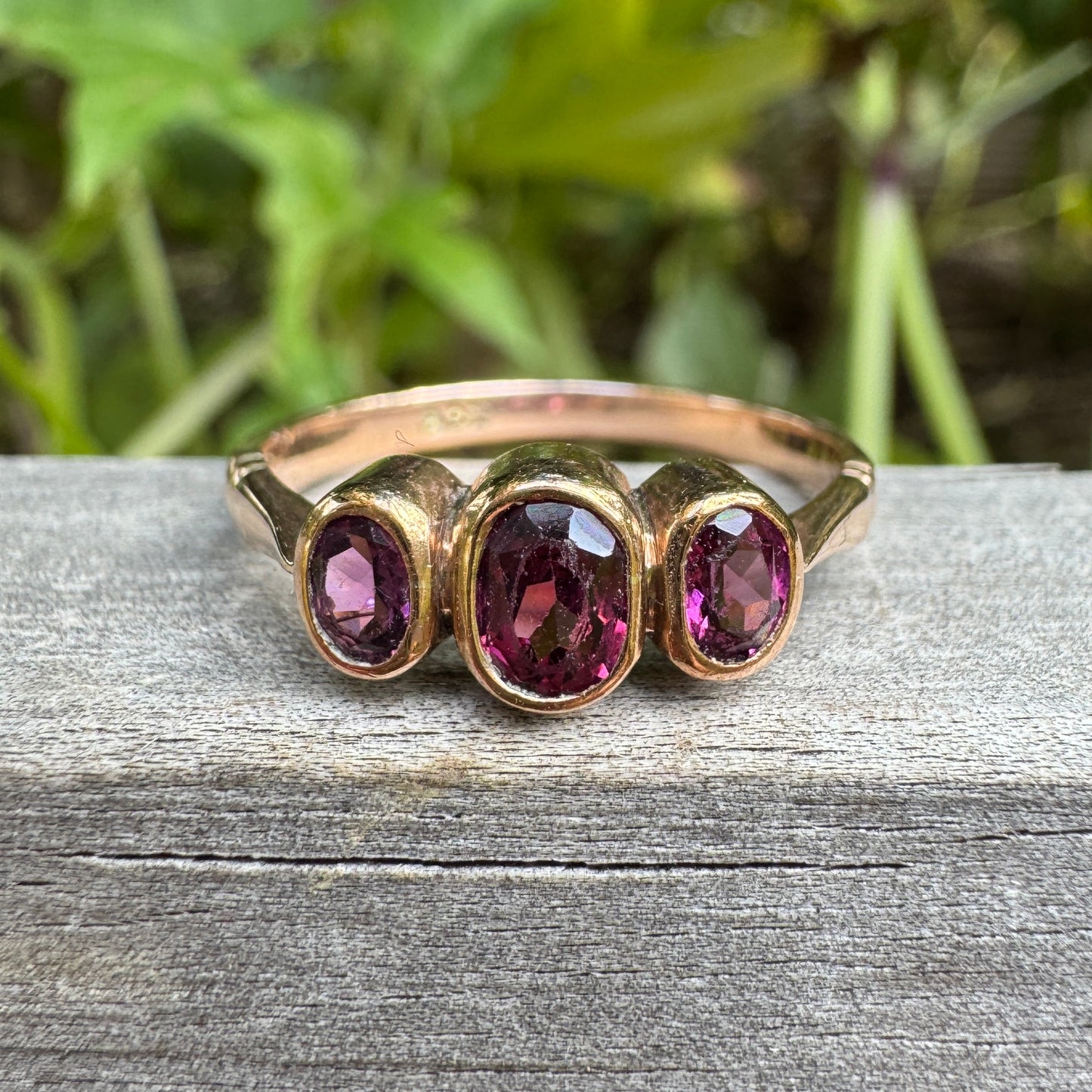 Antique 9ct rose gold three stone 0.7ct TCW garnet bezel set ring