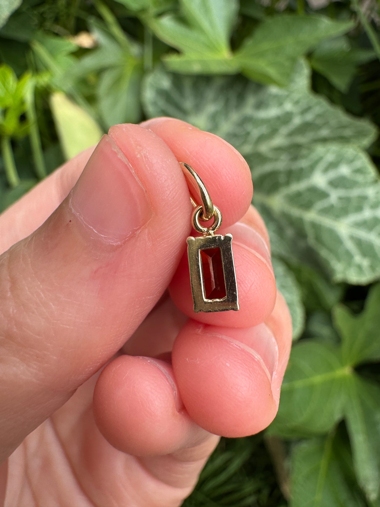 Custom 9ct yellow gold 0.68ct emerald cut garnet pendant