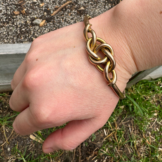 Vintage 9ct rosy yellow gold knot bangle