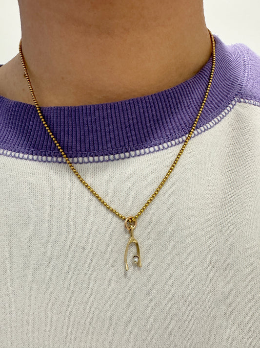 Vintage 14ct yellow gold and pearl wishbone charm