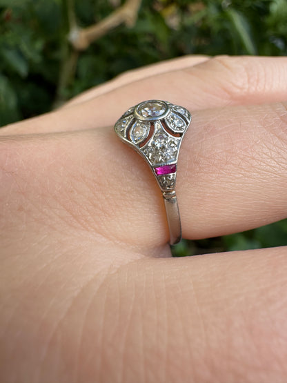 Antique platinum 0.17ct old mine cut and 0.12ct TCW old single cut diamond ring with accent ruby cabochons