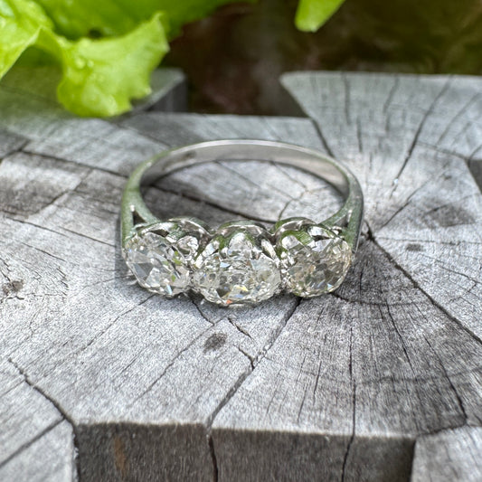 Vintage platinum 1.12ct TCW three stone old mine cut diamond ring