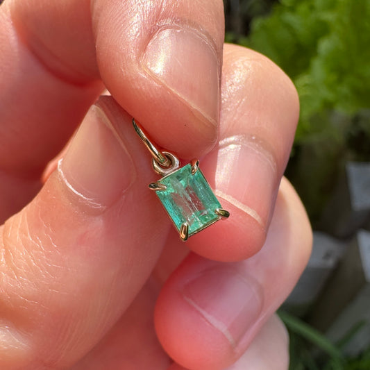 Custom 9ct yellow gold 0.56ct emerald claw set pendant