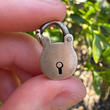 Antique 9ct rose gold padlock pendant