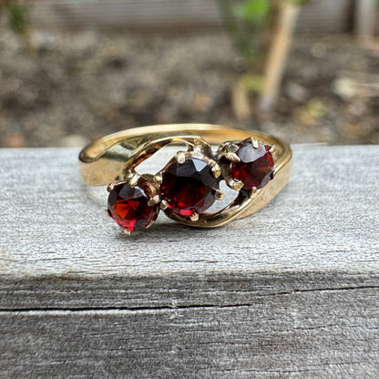 Antique Australian 18ct yellow gold three stone 0.46ct TCW garnet crossover ring