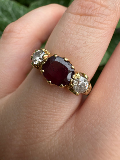 Antique 18ct yellow gold three stone 0.95ct flat cut garnet and 0.45ct TCW old European cut diamond ring