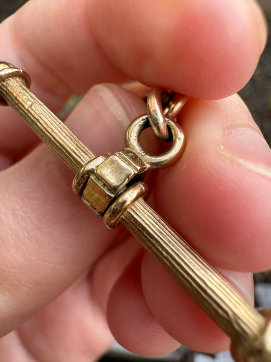 Vintage 9ct yellow gold spinning t-bar pendant