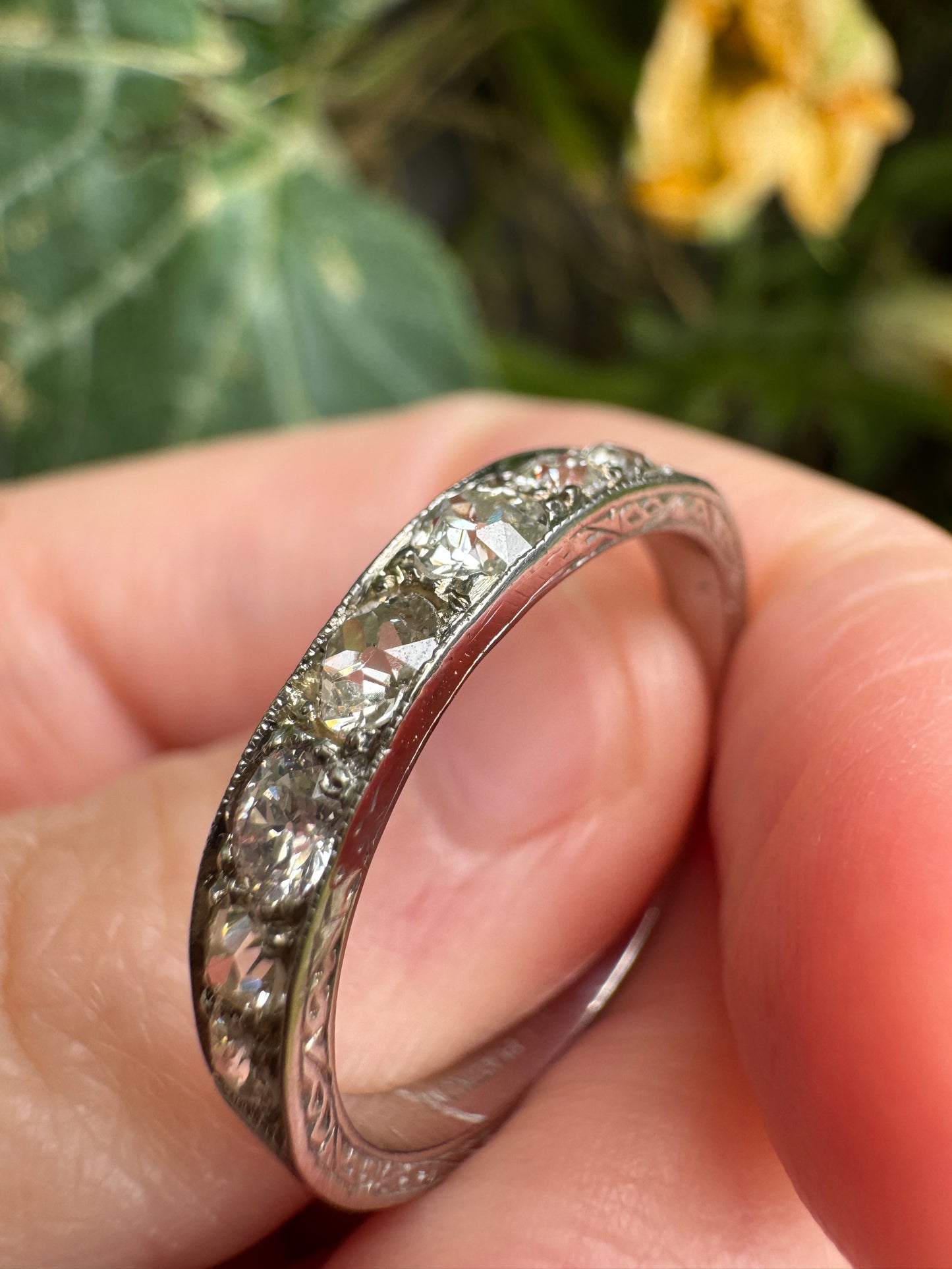 Vintage platinum 0.7ct TCW old mine cut diamond engraved half eternity ring