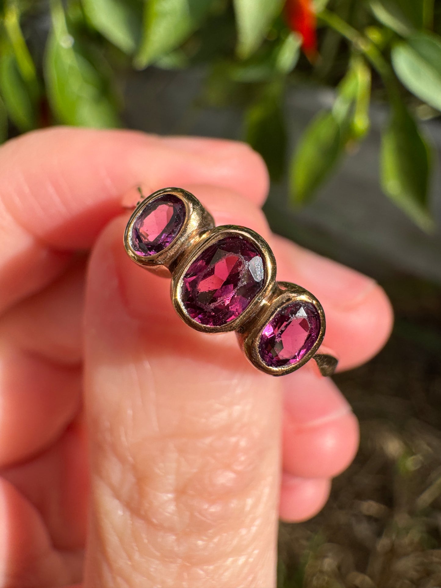 Antique 9ct rose gold three stone 0.7ct TCW garnet bezel set ring