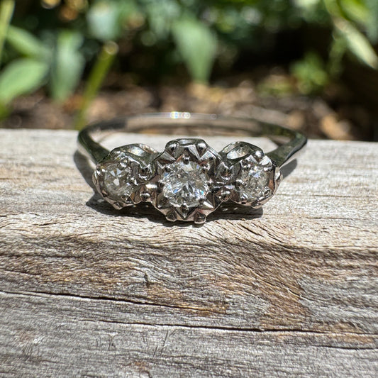Vintage 18ct white gold and platinum three stone 0.16ct TCW old mine cut and old European cut diamond ring