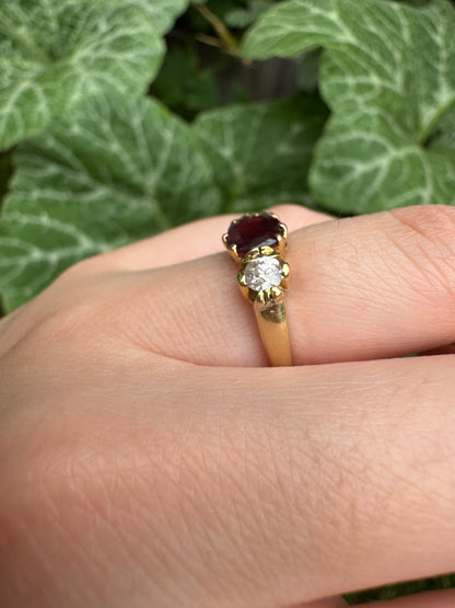 Antique 18ct yellow gold three stone 0.95ct flat cut garnet and 0.45ct TCW old European cut diamond ring
