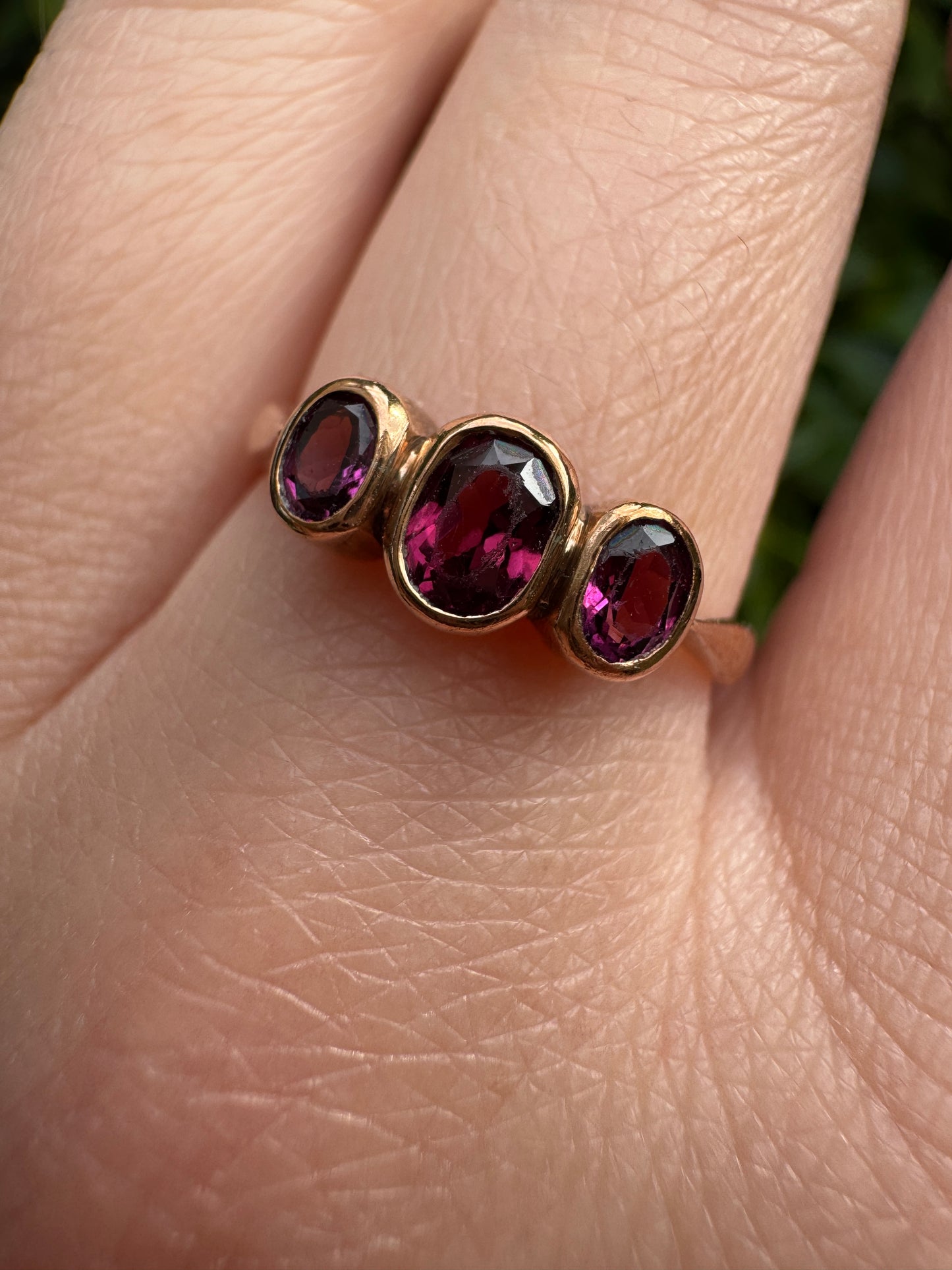 Antique 9ct rose gold three stone 0.7ct TCW garnet bezel set ring