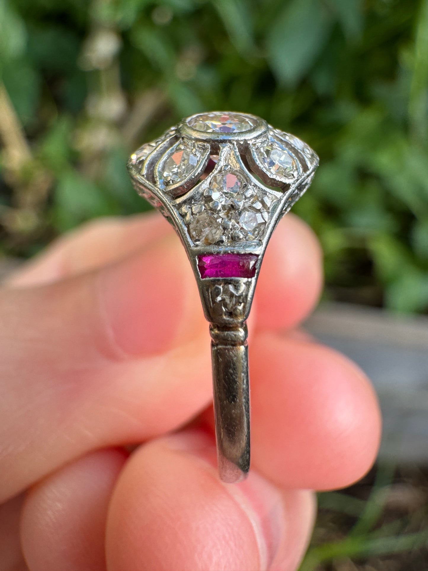 Antique platinum 0.17ct old mine cut and 0.12ct TCW old single cut diamond ring with accent ruby cabochons