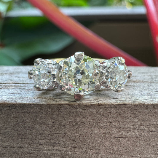 Antique 18ct yellow gold three stone 1.56ct TCW old mine cut diamond ring