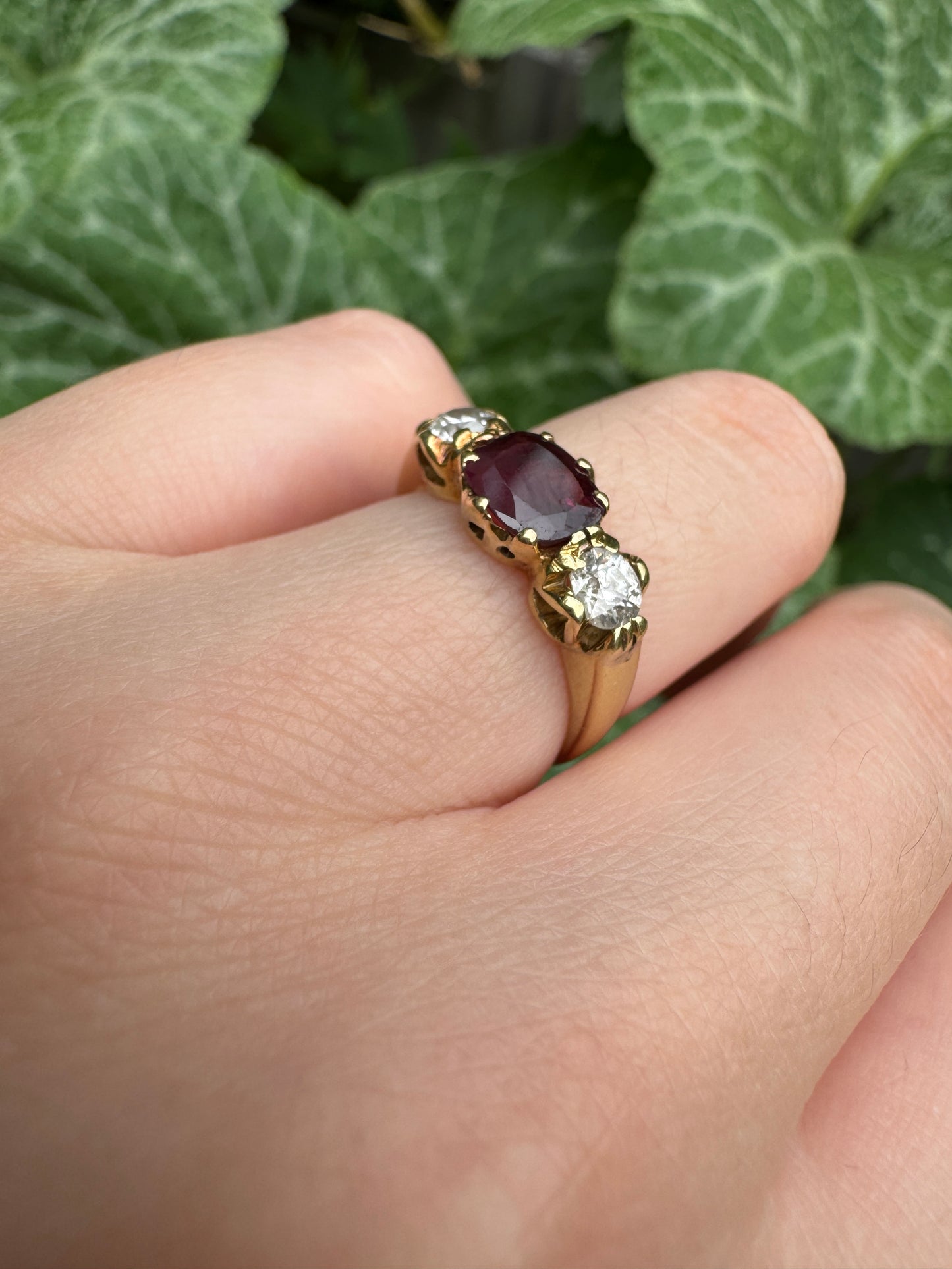 Antique 18ct yellow gold three stone 0.95ct flat cut garnet and 0.45ct TCW old European cut diamond ring