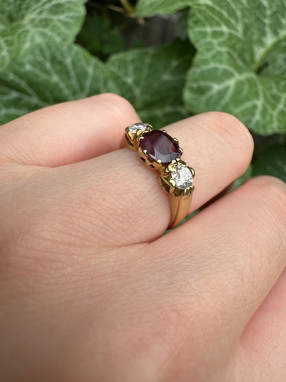 Antique 18ct yellow gold three stone 0.95ct flat cut garnet and 0.45ct TCW old European cut diamond ring