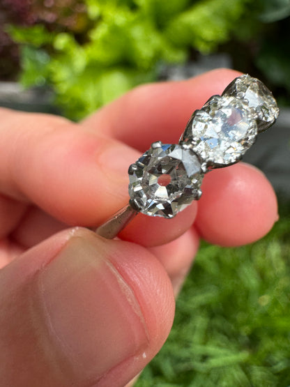 Vintage platinum 1.12ct TCW three stone old mine cut diamond ring