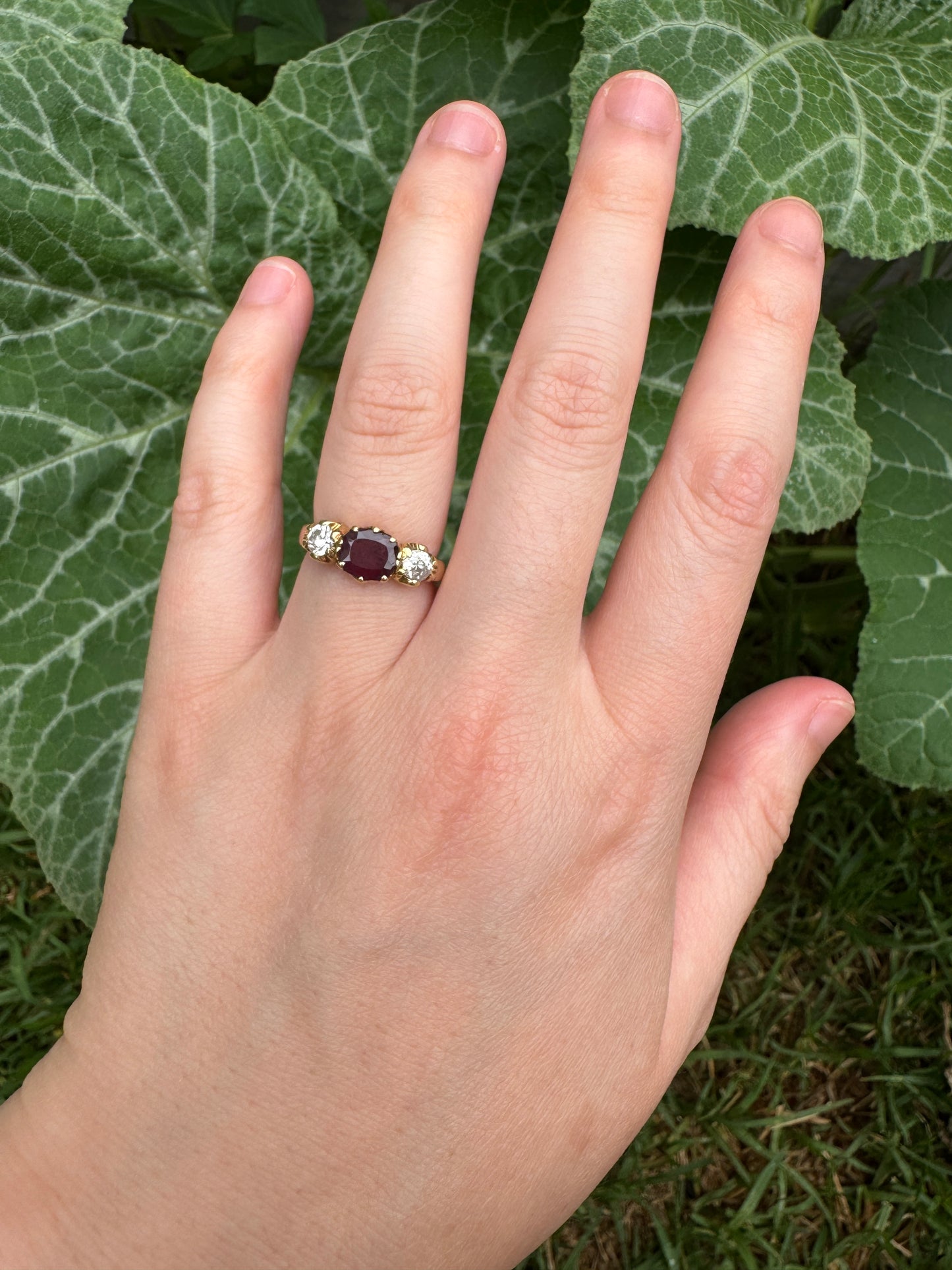Antique 18ct yellow gold three stone 0.95ct flat cut garnet and 0.45ct TCW old European cut diamond ring