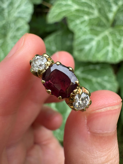 Antique 18ct yellow gold three stone 0.95ct flat cut garnet and 0.45ct TCW old European cut diamond ring