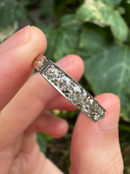 Vintage platinum 0.7ct TCW old mine cut diamond engraved half eternity ring