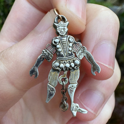 Antique silver and enamel articulated jester charm