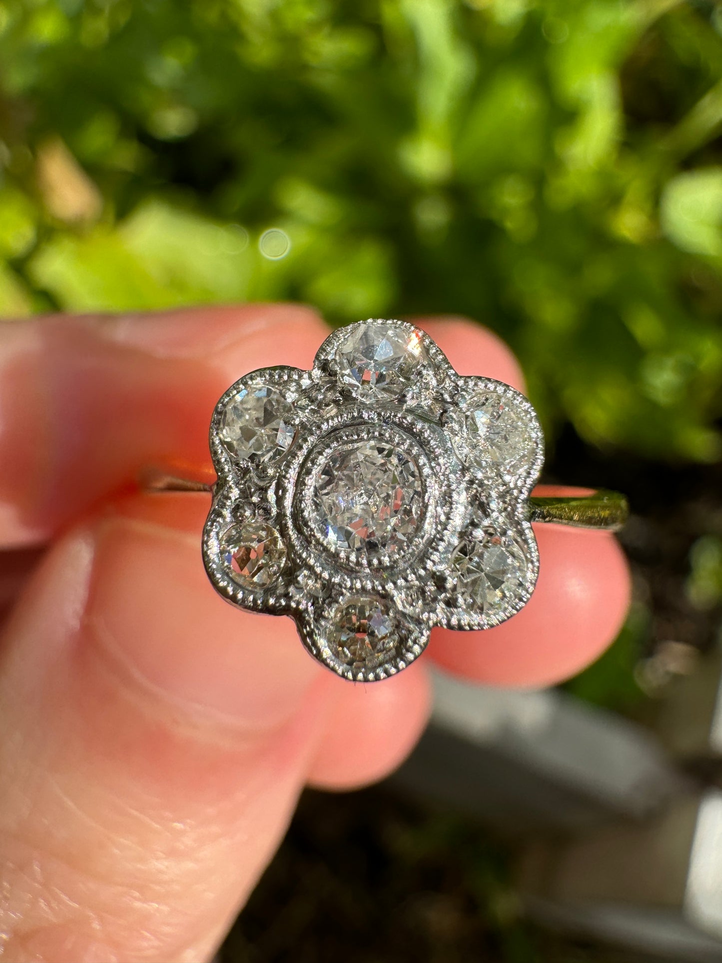 Vintage 18ct yellow gold and platinum 0.55ct TCW old mine cut and single cut diamond daisy ring