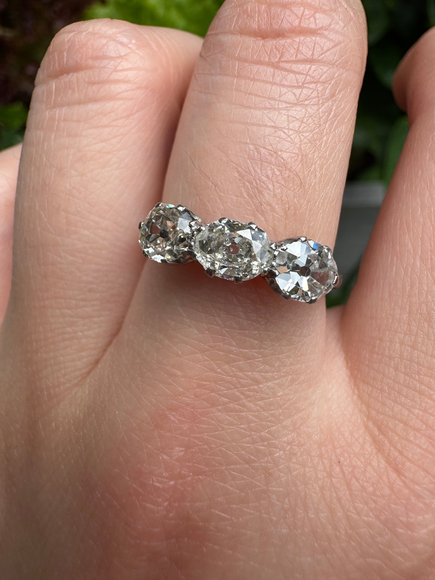 Vintage platinum 1.12ct TCW three stone old mine cut diamond ring