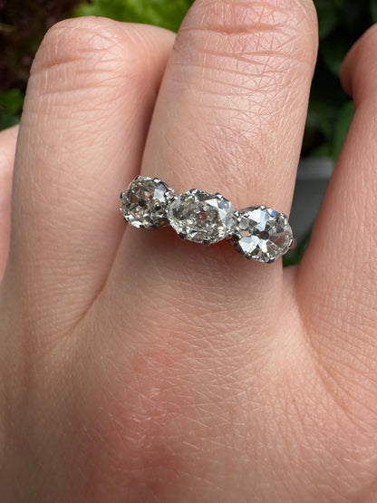 Vintage platinum 1.12ct TCW three stone old mine cut diamond ring