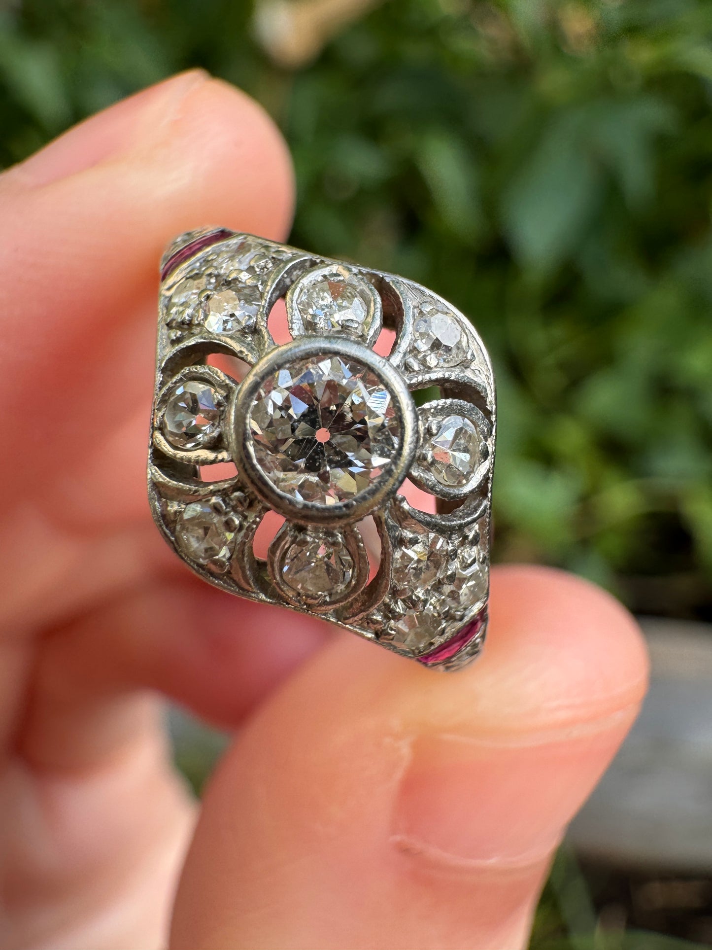 Antique platinum 0.17ct old mine cut and 0.12ct TCW old single cut diamond ring with accent ruby cabochons