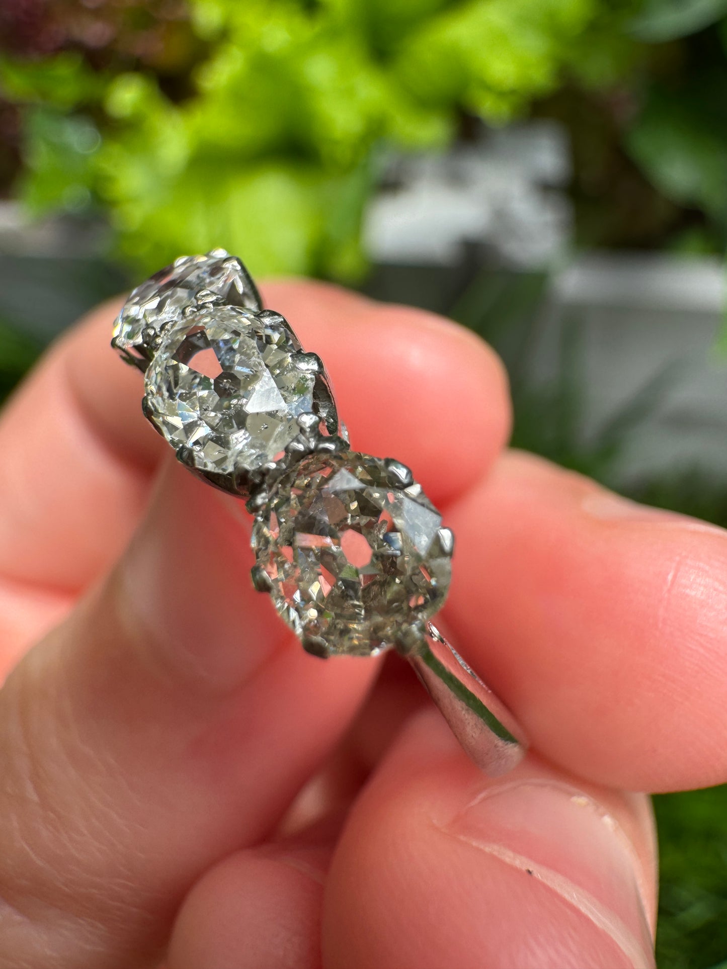 Vintage platinum 1.12ct TCW three stone old mine cut diamond ring