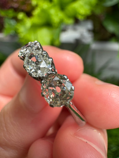 Vintage platinum 1.12ct TCW three stone old mine cut diamond ring