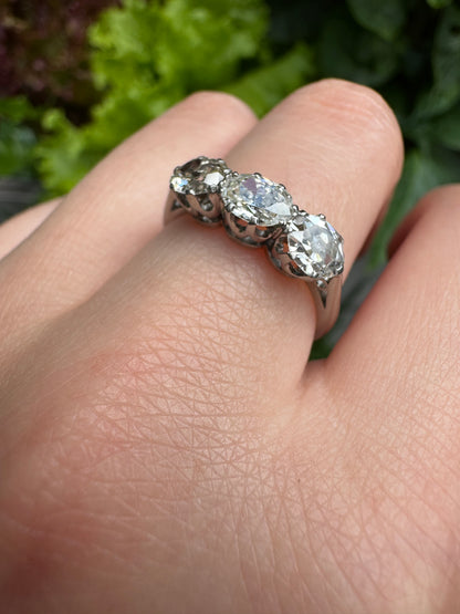 Vintage platinum 1.12ct TCW three stone old mine cut diamond ring