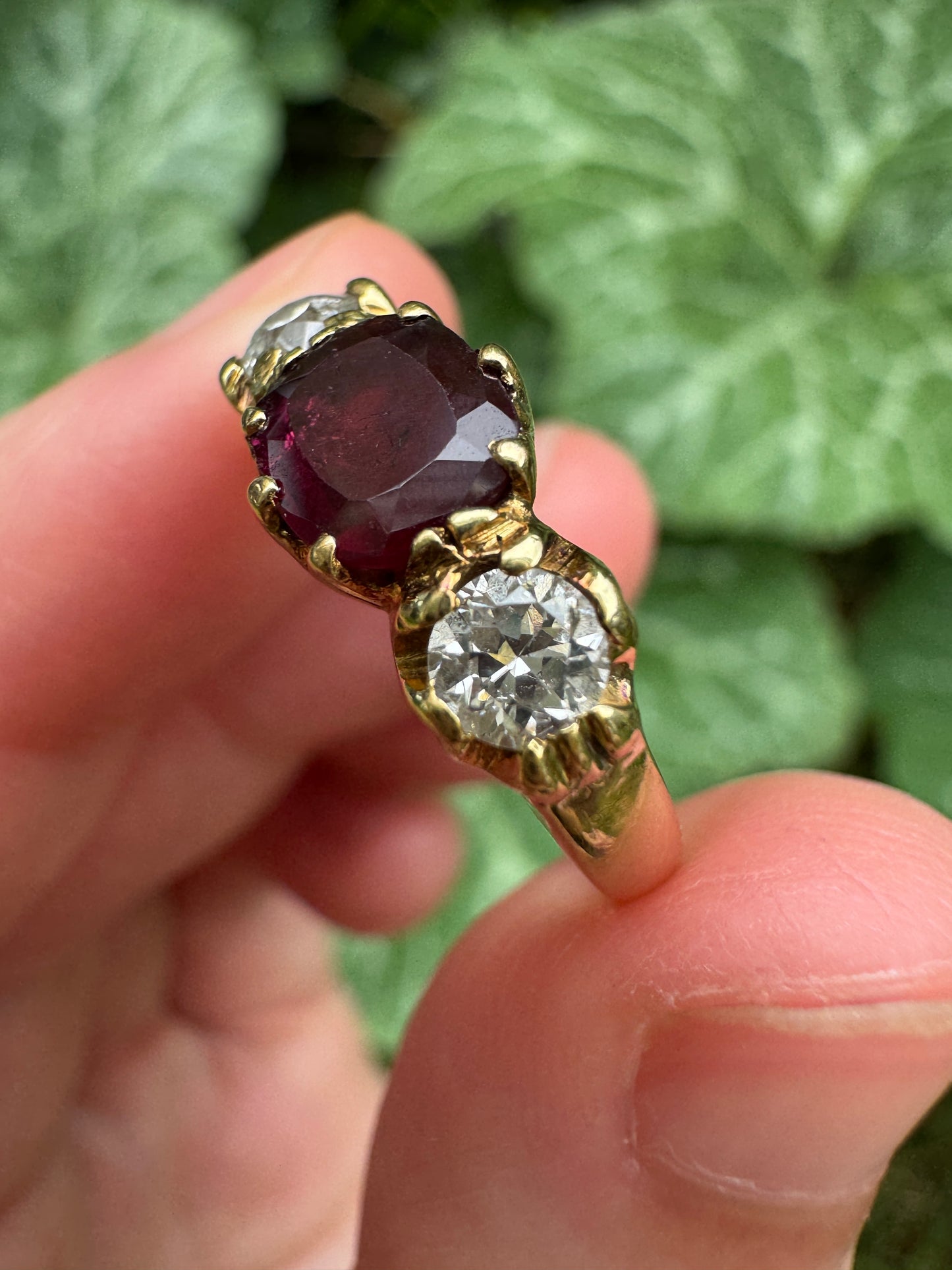 Antique 18ct yellow gold three stone 0.95ct flat cut garnet and 0.45ct TCW old European cut diamond ring