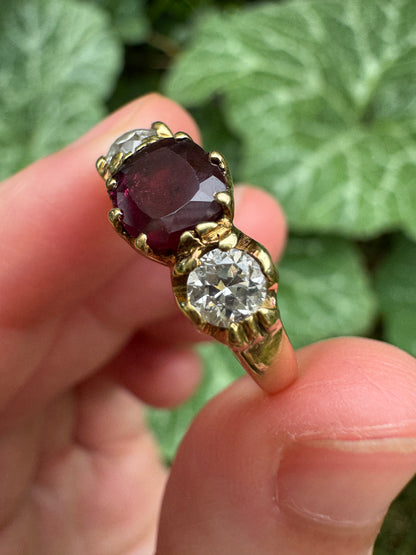 Antique 18ct yellow gold three stone 0.95ct flat cut garnet and 0.45ct TCW old European cut diamond ring