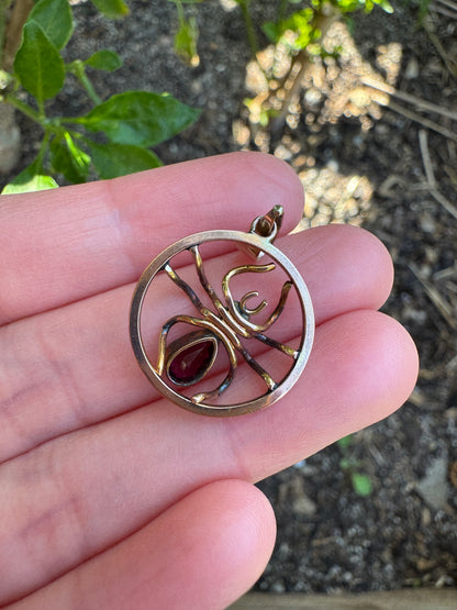 Antique 9ct yellow gold 0.6ct garnet and pearl spider pendant