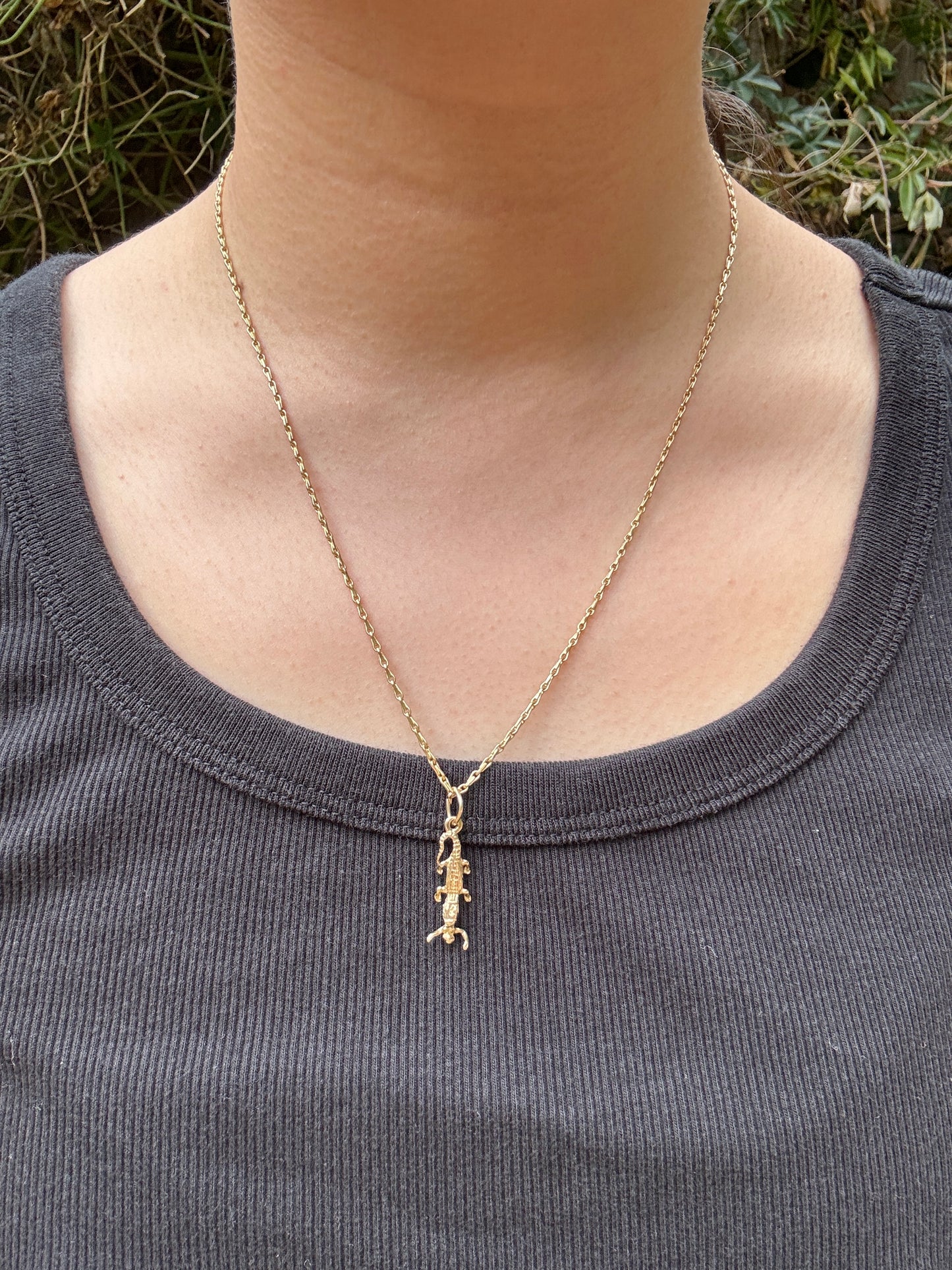 Vintage 9ct yellow gold crocodile with person charm