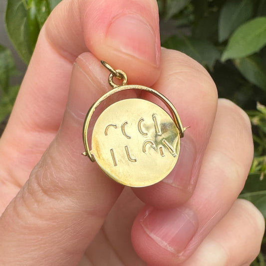 Vintage 9ct yellow gold good luck spinner charm