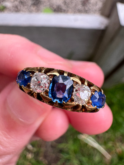 Antique 18ct yellow gold five stone 0.5ct TCW old cut natural sapphire and 0.38ct TCW old mine cut diamond ring