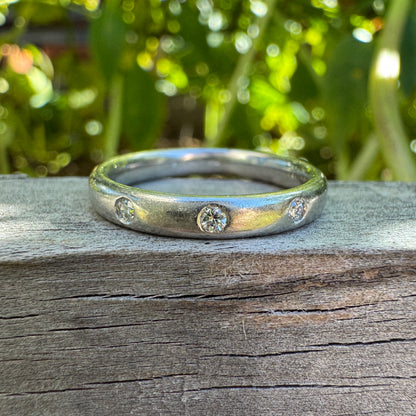 Vintage platinum three stone round brilliant cut diamond gypsy ring