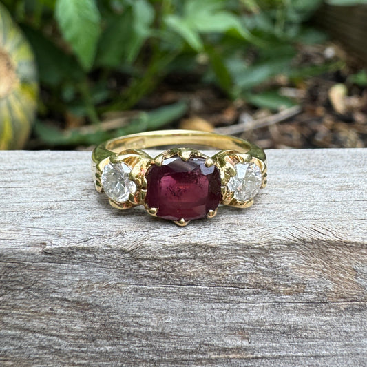 Antique 18ct yellow gold three stone 0.95ct flat cut garnet and 0.45ct TCW old European cut diamond ring
