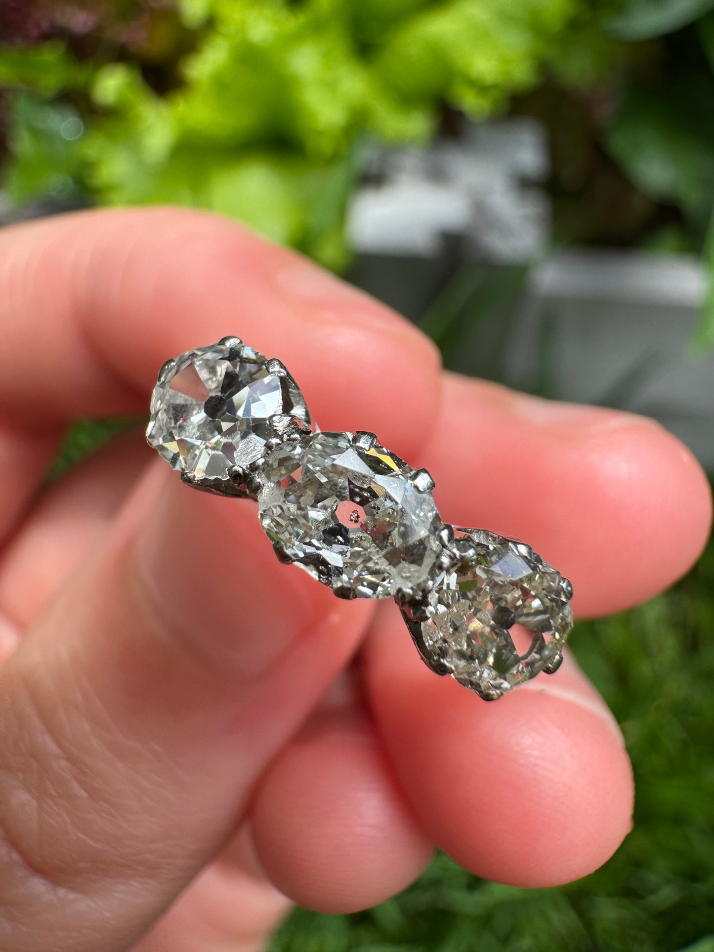 Vintage platinum 1.12ct TCW three stone old mine cut diamond ring