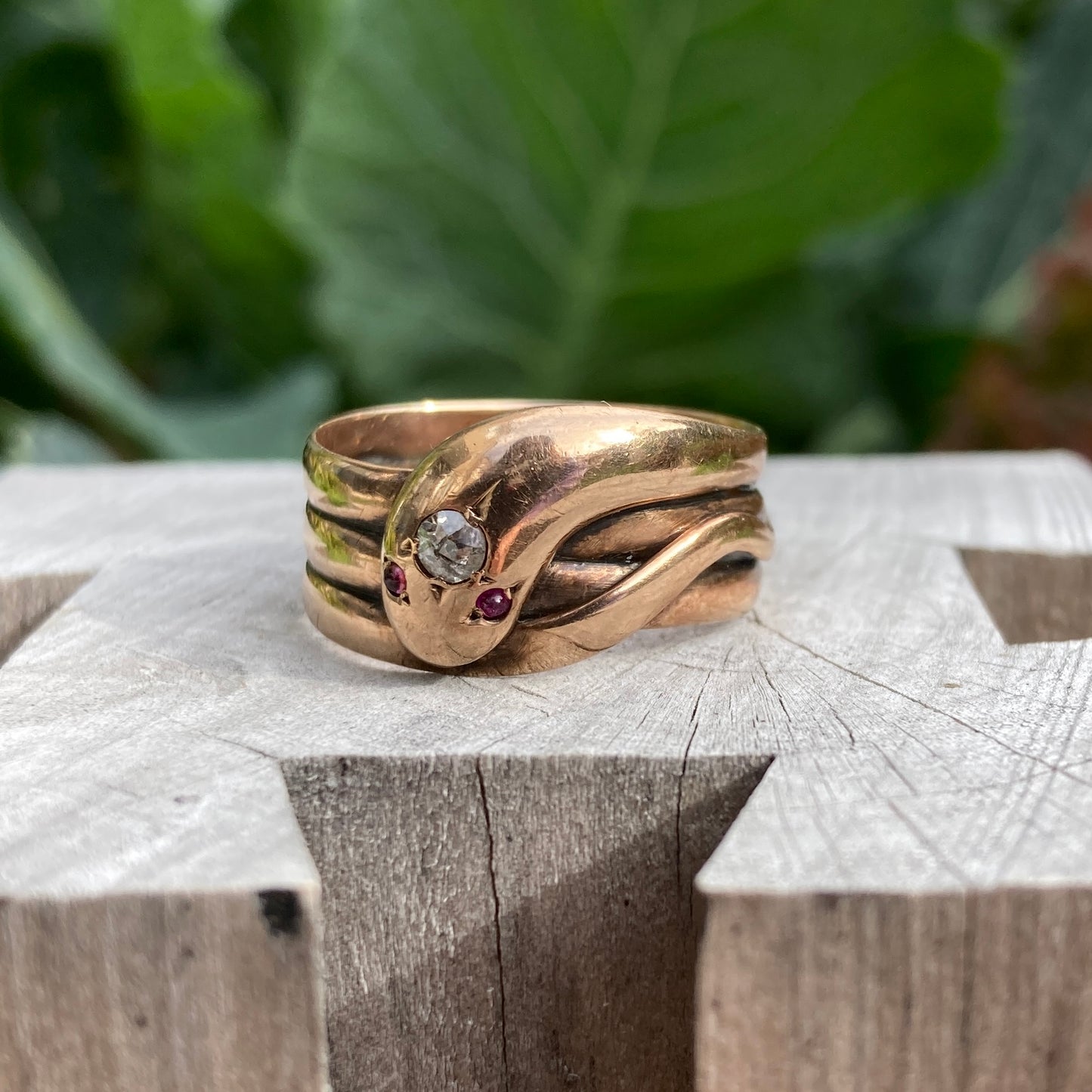 Antique 9ct rose gold old cut diamond and ruby cabochon snake ring