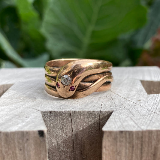 Antique 9ct rose gold old cut diamond and ruby cabochon snake ring